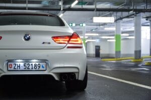 white bmw m 3 on road during daytime
