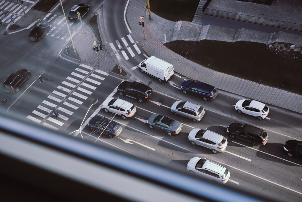 white and black cars on parking lot during daytime