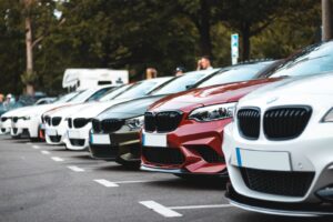 white and red bmw m 3 on road during daytime