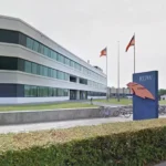 An RDW office building with a clear sign in front.