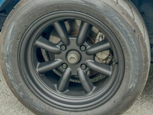 A close up of a tire on a car